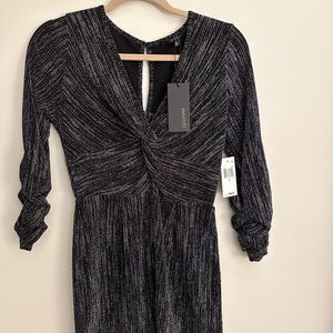 Macy’s | Long Sleeve Black Romper with Glitter Detail